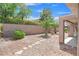 Landscaped backyard featuring a stone water fountain and plenty of space for outdoor enjoyment at 2573 Grandville Ave, Henderson, NV 89052