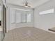 Cozy dining area featuring tile flooring, a modern ceiling fan, and large windows for abundant natural light at 2573 Grandville Ave, Henderson, NV 89052