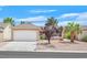 Charming single-story home with a two-car garage, desert landscaping, and mature trees for added curb appeal at 2573 Grandville Ave, Henderson, NV 89052