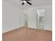 Open bedroom with views to an en-suite bathroom, laundry room and ceiling fan at 2573 Grandville Ave, Henderson, NV 89052