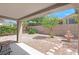 Covered patio overlooking a well-kept yard with stone accents and a charming fountain at 2573 Grandville Ave, Henderson, NV 89052