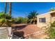 The backyard features lush palms, providing privacy and a tropical feel at 2612 Sonora St, Las Vegas, NV 89102