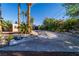 Backyard pool area surrounded by lush landscaping, palm trees and stone at 2612 Sonora St, Las Vegas, NV 89102