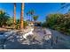 Backyard featuring a pool with a diving board surrounded by palm trees and foliage at 2612 Sonora St, Las Vegas, NV 89102