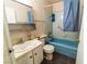 Bathroom features blue fixtures, vanity, and medicine cabinet at 2612 Sonora St, Las Vegas, NV 89102