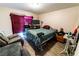 Spacious bedroom with a bed, lounge chair and dresser at 2612 Sonora St, Las Vegas, NV 89102