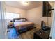 This bedroom features a large flat screen tv and is located near other living areas at 2612 Sonora St, Las Vegas, NV 89102