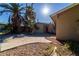 A view of the home's front facade and the expansive driveway with desert landscaping at 2612 Sonora St, Las Vegas, NV 89102