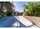 Well-maintained single-level home with mature trees, desert landscaping, and a large driveway at 2612 Sonora St, Las Vegas, NV 89102