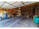 Well-lit garage featuring exposed ceiling and storage racks for organized parking and storage at 2612 Sonora St, Las Vegas, NV 89102