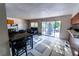 Bright kitchen with tile floors, access to the backyard, and an adjoining living area at 2612 Sonora St, Las Vegas, NV 89102