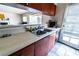 Functional kitchen with tile flooring, wooden cabinets, and practical design at 2612 Sonora St, Las Vegas, NV 89102