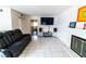 Cozy living room with a fireplace, tile floors, and a relaxing atmosphere at 2612 Sonora St, Las Vegas, NV 89102