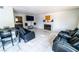 Relaxing living room with white tile flooring, comfortable seating, and a cozy fireplace at 2612 Sonora St, Las Vegas, NV 89102