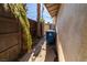Side yard of home with fence and foliage at 2612 Sonora St, Las Vegas, NV 89102