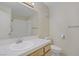 Well-lit bathroom featuring white tile flooring, single sink, and shower at 2725 S Nellis Blvd # 1056, Las Vegas, NV 89121