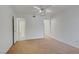 Carpeted bedroom with neutral paint, ceiling fan, and ensuite bathroom at 2725 S Nellis Blvd # 1056, Las Vegas, NV 89121