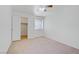 Neutral bedroom featuring a ceiling fan, closet, and window at 2725 S Nellis Blvd # 1056, Las Vegas, NV 89121