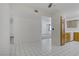 Spacious kitchen area featuring white tile flooring and ample natural light at 2725 S Nellis Blvd # 1056, Las Vegas, NV 89121