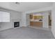 The open-concept living space features a fireplace, and seamless flow into the adjacent kitchen at 2725 S Nellis Blvd # 1056, Las Vegas, NV 89121