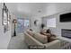 Bright living room featuring neutral tones, fireplace, and sliding glass doors to a private balcony at 2725 S Nellis Blvd # 1056, Las Vegas, NV 89121
