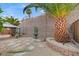 Landscaped backyard with mature trees, a gazebo, and a decorative water fountain at 2820 Goldcreek St, Henderson, NV 89052