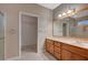 Bathroom features double sinks and vanity with framed mirror and shower at 2820 Goldcreek St, Henderson, NV 89052