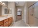 Bright bathroom boasts double sinks, granite counters, walk in shower and access to bedroom at 2820 Goldcreek St, Henderson, NV 89052