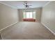 Carpeted bedroom features a ceiling fan and a charming window bench seating area at 2820 Goldcreek St, Henderson, NV 89052