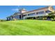 Well-manicured lawns surrounding a luxurious clubhouse, offering a glimpse of upscale community living at 2820 Goldcreek St, Henderson, NV 89052