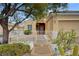 Inviting single-story home with desert landscaping and a cozy front porch with seating at 2820 Goldcreek St, Henderson, NV 89052