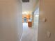 Hallway view leading to a kitchen with granite countertops and stainless steel appliances at 2820 Goldcreek St, Henderson, NV 89052