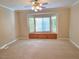 Bright living room featuring a bay window with built in shelving and a ceiling fan at 2820 Goldcreek St, Henderson, NV 89052