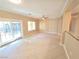 Bright living room with sliding door access to the backyard and neutral tile flooring at 2820 Goldcreek St, Henderson, NV 89052