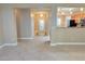 Open floorplan features neutral tile flooring and views into the entry and kitchen at 2820 Goldcreek St, Henderson, NV 89052
