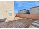 Backyard view with bricked patio, gravel and pavers at 2824 Mozia Ct, Henderson, NV 89044