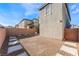 A clean backyard features gravel, a brick perimeter wall, and concrete paver stepping stones at 2824 Mozia Ct, Henderson, NV 89044