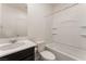 Bathroom featuring a shower and bath combination, dark cabinets, and chrome fixtures at 2824 Mozia Ct, Henderson, NV 89044