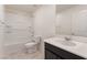 Clean bathroom with a tub and shower, dark cabinets, and a white countertop at 2824 Mozia Ct, Henderson, NV 89044