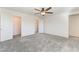 Bedroom with gray carpet features closet with sliding doors and an adjacent hallway at 2824 Mozia Ct, Henderson, NV 89044