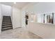 Inviting entryway with tiled floors and staircase leading to the upper level of the home at 2824 Mozia Ct, Henderson, NV 89044