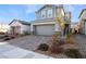 Attractive two-story house displaying a spacious paved driveway and landscaped yard at 2824 Mozia Ct, Henderson, NV 89044
