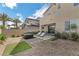 Beautiful backyard featuring lounge chairs, an inflatable hot tub, and lush landscaping for outdoor enjoyment at 2935 Gaffer Film St, Las Vegas, NV 89156