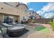 Spacious backyard featuring an inflatable hot tub, lounge chairs, and low-maintenance landscaping at 2935 Gaffer Film St, Las Vegas, NV 89156