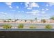 Balcony view captures a tranquil city skyline and clear blue sky, complemented by manicured landscaping at 2935 Gaffer Film St, Las Vegas, NV 89156
