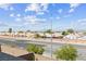 Balcony view overlooks rooftops and a wide street, extending to the distant city skyline and clear blue sky at 2935 Gaffer Film St, Las Vegas, NV 89156
