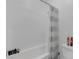 Clean white bathroom with a tiled shower and bathtub combination and modern fixtures at 2935 Gaffer Film St, Las Vegas, NV 89156
