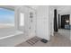 Bright bathroom featuring a tub, glass shower and modern flooring at 2935 Gaffer Film St, Las Vegas, NV 89156