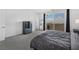 Spacious bedroom with walkout balcony, gray carpet, and dresser offers a calming space at 2935 Gaffer Film St, Las Vegas, NV 89156