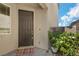 Charming front entrance with a dark-colored front door and a 'Welcome' mat at 2935 Gaffer Film St, Las Vegas, NV 89156